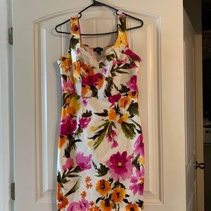 White and floral pattern sleeveless dress.